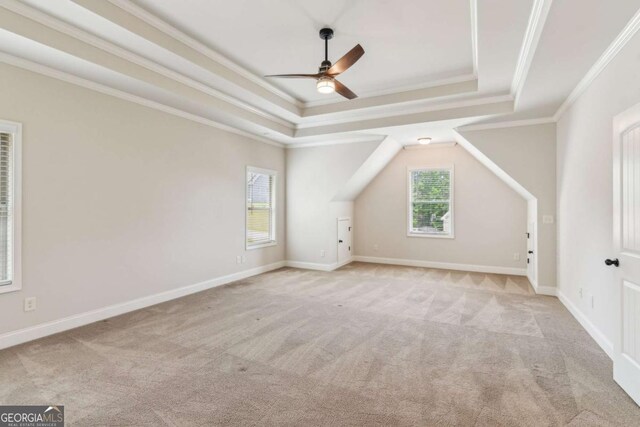 additional living space with carpet floors, ceiling fan, and baseboards