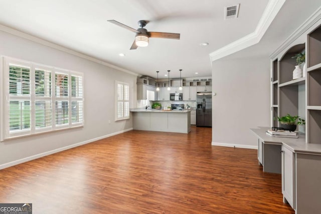 unfurnished living room with ornamental molding, dark wood finished floors, ceiling fan, recessed lighting, and baseboards
