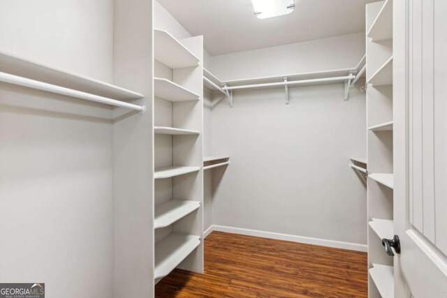 spacious closet with wood finished floors