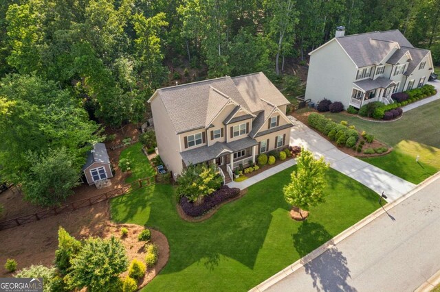 view of subject property with a heavily wooded area