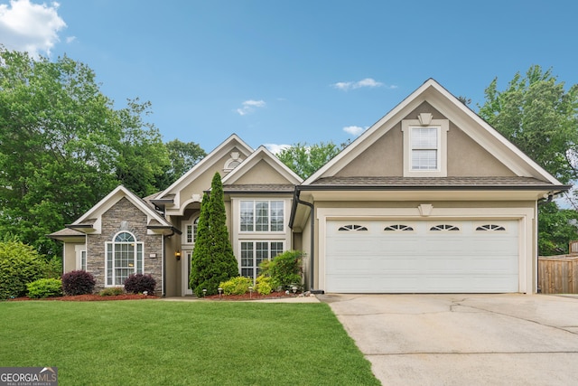 view of front of home with concrete driveway, stucco siding, a front lawn, and stone siding