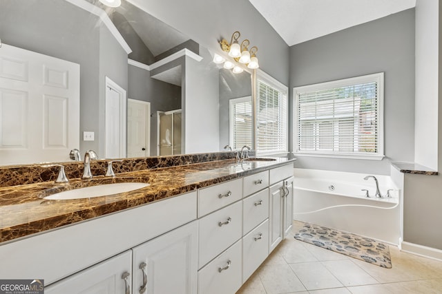 1020 Regency Dr, Acworth, GA 30102 - full bath featuring double vanity, a bath, a stall shower, tile patterned floors, and lofted ceiling