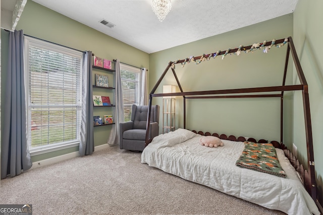 1020 Regency Dr, Acworth, GA 30102 - carpeted bedroom featuring baseboards and a textured ceiling