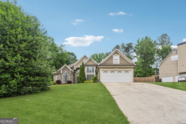 traditional home featuring concrete driveway, an attached garage, and stucco siding
