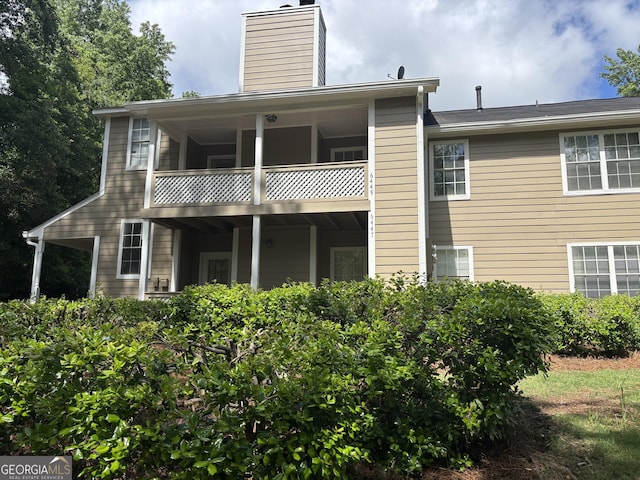 6449 Pinebark Way, Morrow, GA 30260 - back of house featuring a chimney