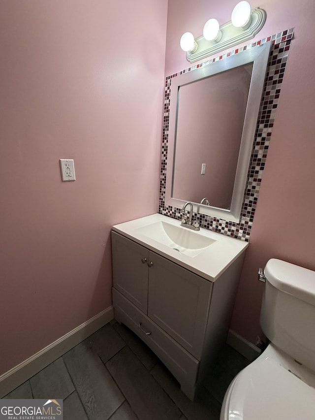 6449 Pinebark Way, Morrow, GA 30260 - bathroom featuring toilet, vanity, tile patterned flooring, and baseboards