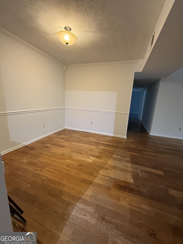 6449 Pinebark Way, Morrow, GA 30260 - spare room with wood finished floors, baseboards, and a textured ceiling
