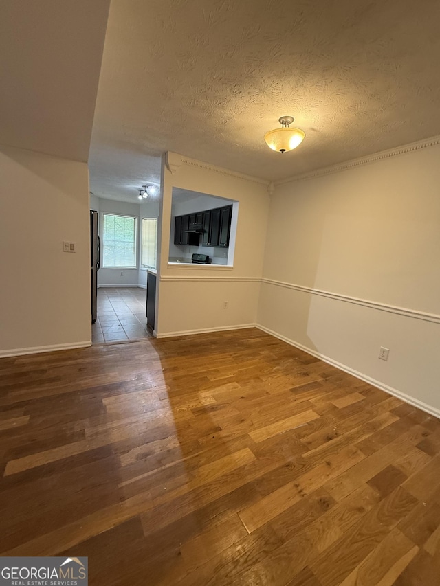 6449 Pinebark Way, Morrow, GA 30260 - unfurnished room featuring wood finished floors, a textured ceiling, and baseboards