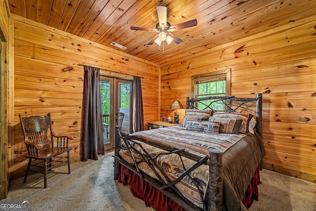 bedroom featuring carpet flooring, multiple windows, access to outside, wood walls, and wooden ceiling