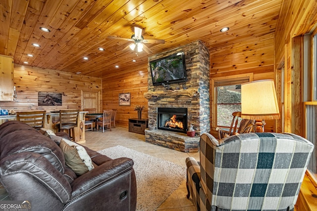 living room with tile patterned floors, wooden walls, wood ceiling, a fireplace, and recessed lighting