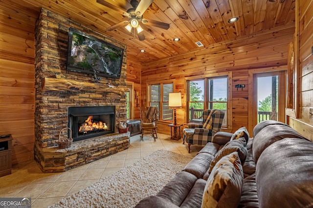 living area with tile patterned floors, wood ceiling, a fireplace, recessed lighting, and ceiling fan