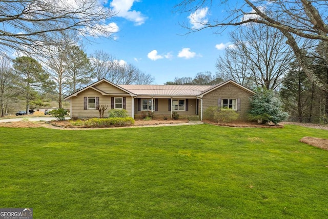 ranch-style home with a front lawn and metal roof