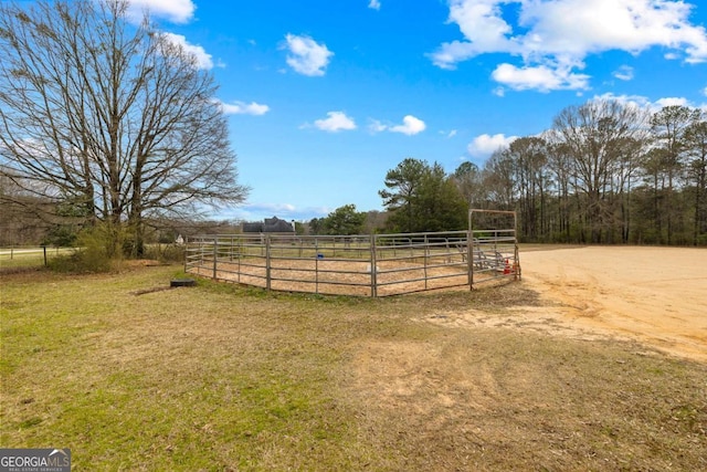 view of yard featuring a view of rural / pastoral area and fence