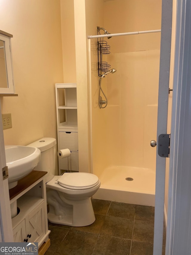 full bath featuring a shower stall, toilet, and vanity