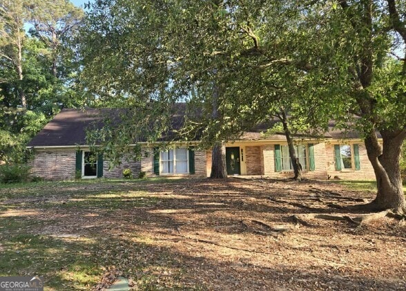 view of front of house with brick siding