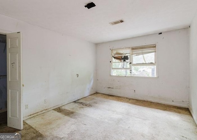 unfurnished room with concrete floors