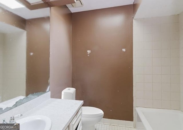 bathroom featuring tile patterned floors, toilet, and vanity