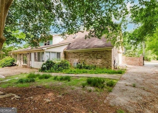 view of front of home featuring brick siding