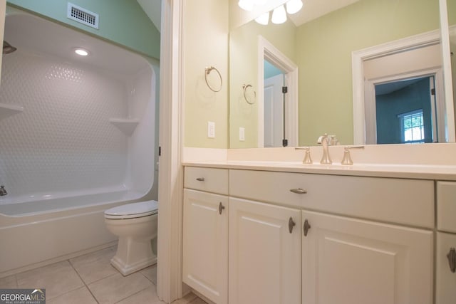 bathroom featuring tile patterned flooring, toilet, vanity, and  shower combination
