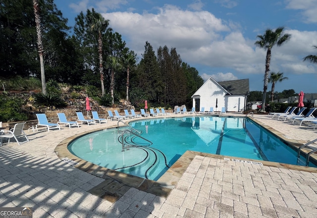 community pool with a patio