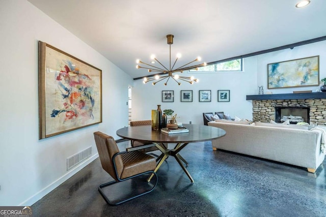 dining space with a chandelier, a fireplace, baseboards, and recessed lighting
