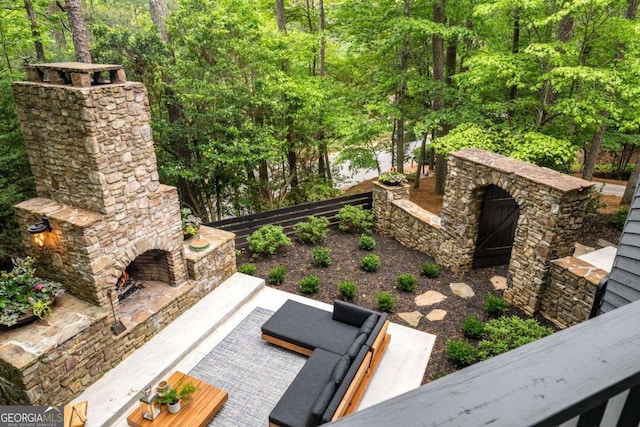 view of patio / terrace with an outdoor stone fireplace