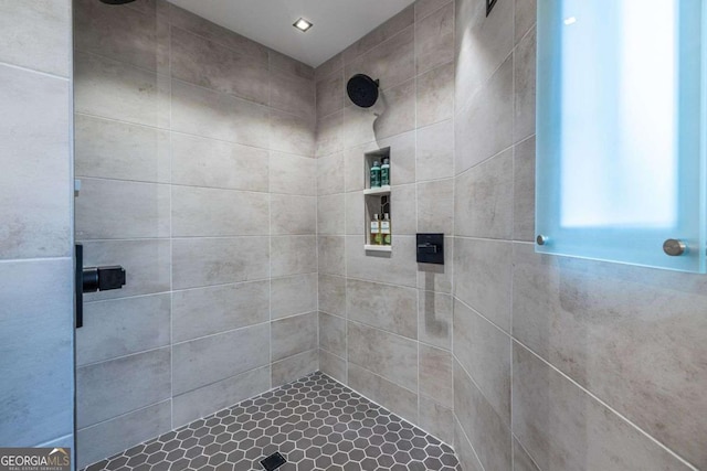 bathroom with tiled shower