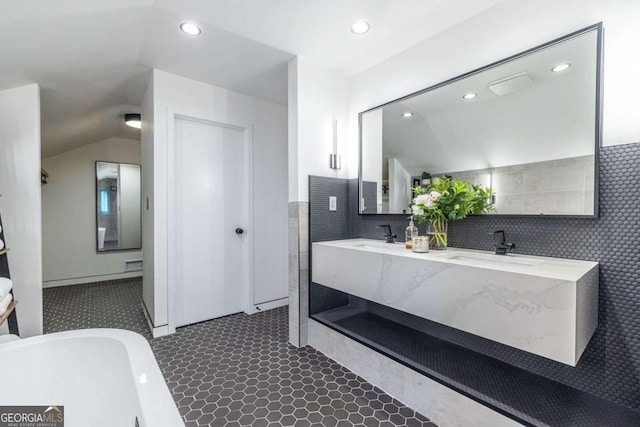 bathroom featuring recessed lighting, tile walls, and double vanity
