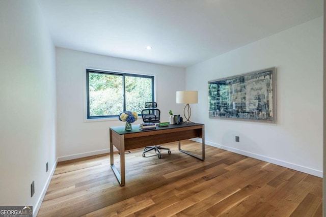 home office featuring wood finished floors, baseboards, and recessed lighting