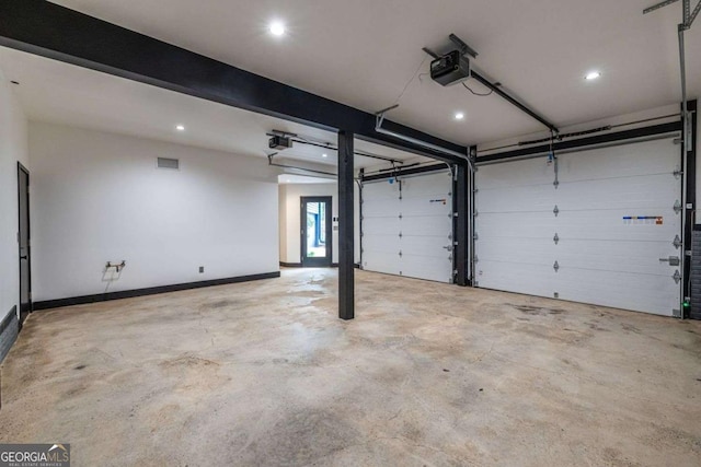 garage featuring a garage door opener, recessed lighting, and baseboards
