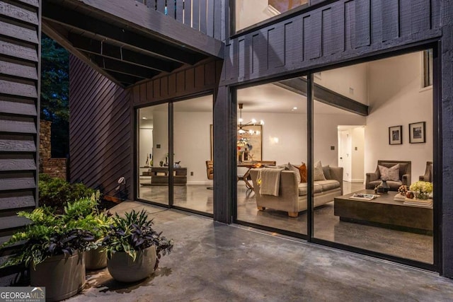 doorway to property with an outdoor living space and a patio