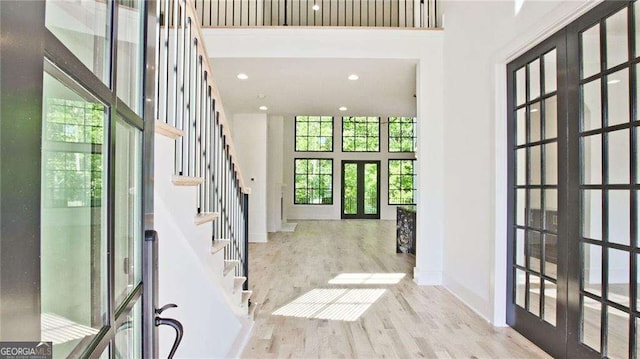2346 E Maddox Rd, Buford, GA 30518 - entryway with a towering ceiling, french doors, wood finished floors, baseboards, and stairway