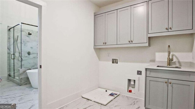 2346 E Maddox Rd, Buford, GA 30518 - laundry room with light marble finish floors, electric dryer hookup, cabinet space, hookup for a washing machine, and baseboards