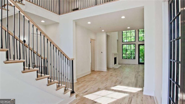 2346 E Maddox Rd, Buford, GA 30518 - entryway with a high ceiling, wood finished floors, stairway, recessed lighting, and baseboards
