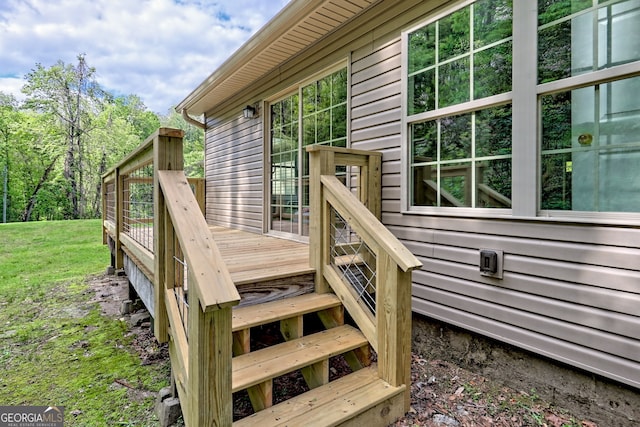 deck featuring a yard