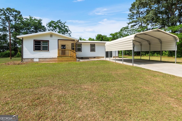 144 Bryant Rd, Cordele, GA 31015 - view of front of house with a front yard, driveway, a detached carport, and crawl space
