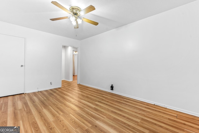 144 Bryant Rd, Cordele, GA 31015 - spare room with light wood-style floors, baseboards, and a ceiling fan