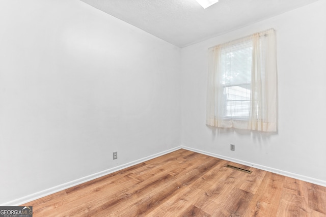 144 Bryant Rd, Cordele, GA 31015 - spare room featuring wood finished floors and baseboards