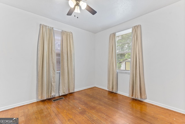 144 Bryant Rd, Cordele, GA 31015 - spare room with ceiling fan, hardwood / wood-style floors, and baseboards