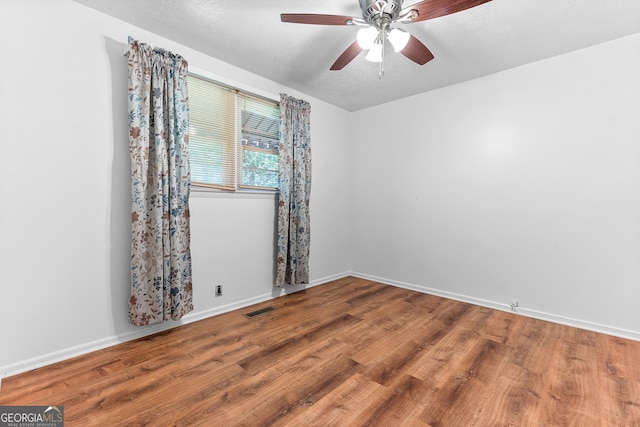 144 Bryant Rd, Cordele, GA 31015 - empty room with ceiling fan, wood finished floors, and baseboards