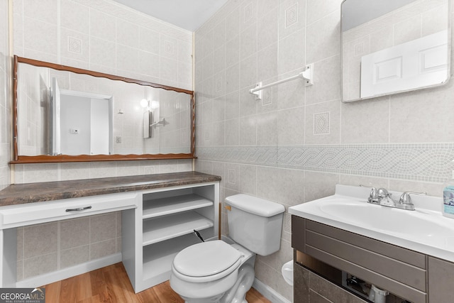 144 Bryant Rd, Cordele, GA 31015 - bathroom featuring tile walls, vanity, toilet, and wood finished floors