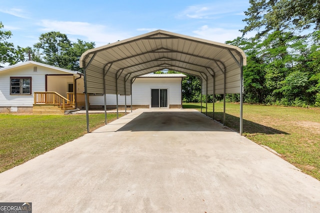 144 Bryant Rd, Cordele, GA 31015 - view of car parking with concrete driveway and a detached carport