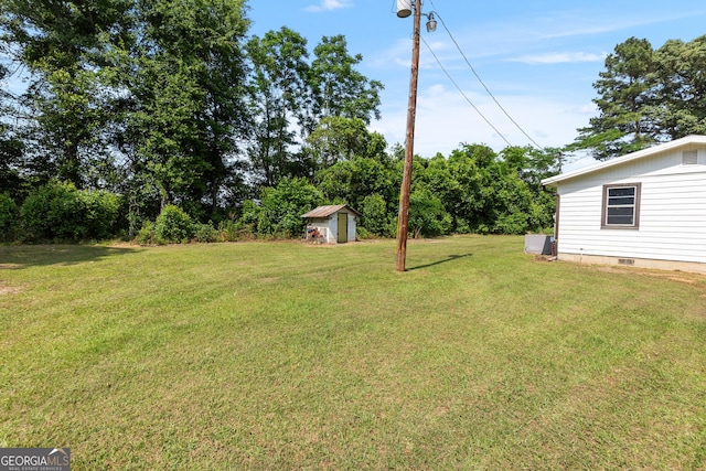144 Bryant Rd, Cordele, GA 31015 - view of grassy yard with a storage shed and an outbuilding