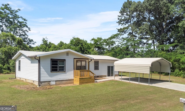 144 Bryant Rd, Cordele, GA 31015 - view of front of home featuring crawl space, a detached carport, and a front yard