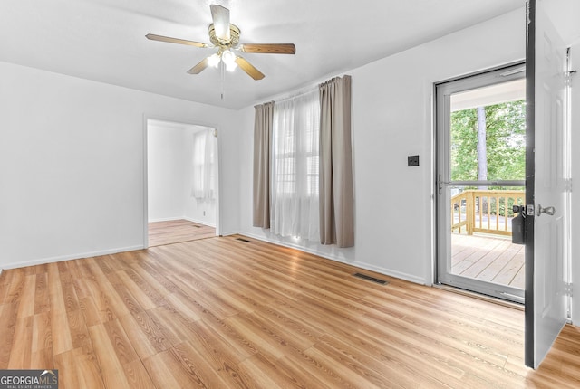 144 Bryant Rd, Cordele, GA 31015 - unfurnished room with light wood-style floors, ceiling fan, and baseboards