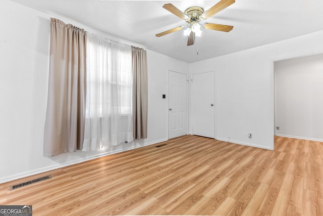 144 Bryant Rd, Cordele, GA 31015 - unfurnished room featuring light wood finished floors, ceiling fan, and baseboards