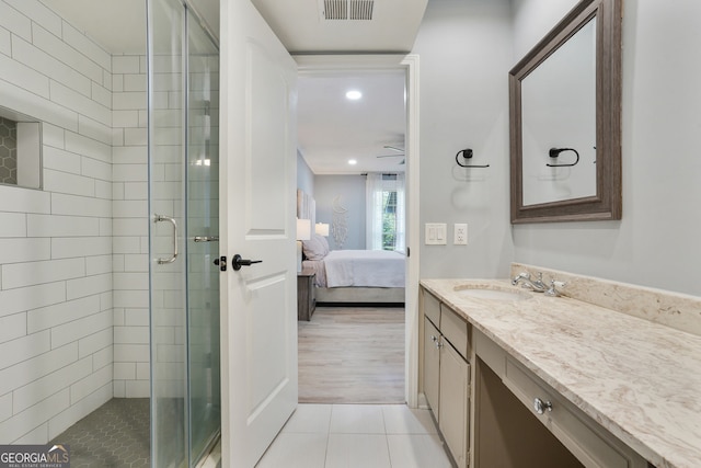6851 Roswell Rd Unit K-23, Atlanta, GA 30328 - ensuite bathroom with vanity, a stall shower, tile patterned flooring, and recessed lighting