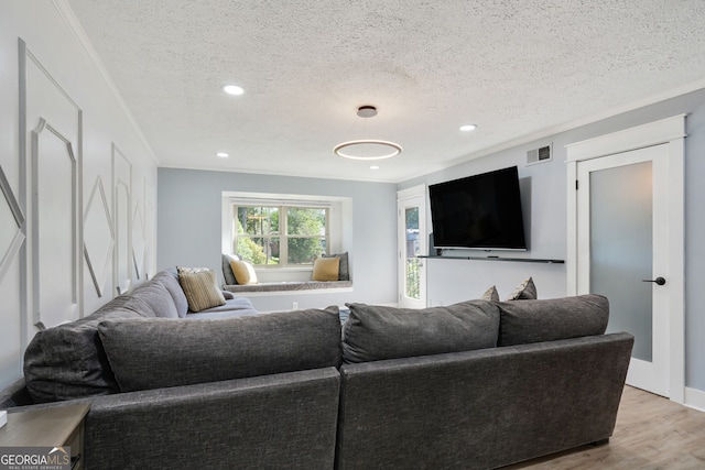 6851 Roswell Rd Unit K-23, Atlanta, GA 30328 - living area with light wood-style flooring, a textured ceiling, crown molding, and recessed lighting
