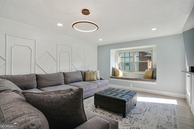 6851 Roswell Rd Unit K-23, Atlanta, GA 30328 - living area featuring wood finished floors, ornamental molding, baseboards, a textured ceiling, and recessed lighting