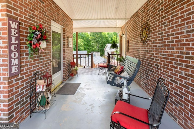 view of patio featuring a porch
